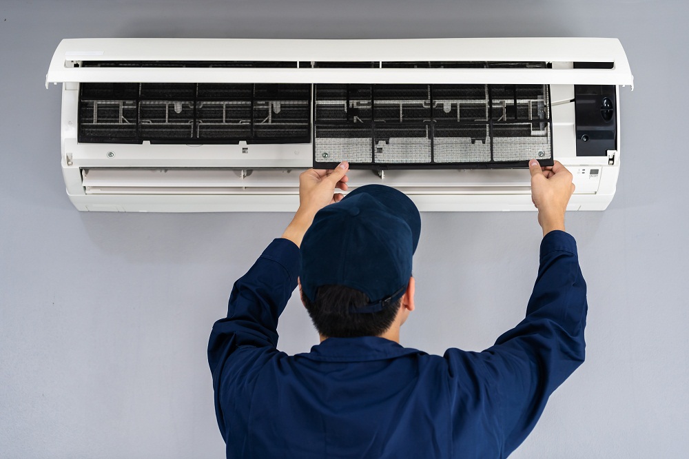 technician service removing air filter of air conditioner for cleaning technician service removing air filter of the air conditioner for cleaning